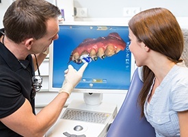 Dentist and patient looking at digital smile design