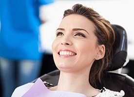 Smiling woman in dental exam room