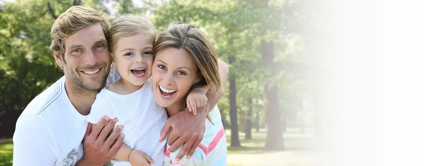 Mother father and child smiling together