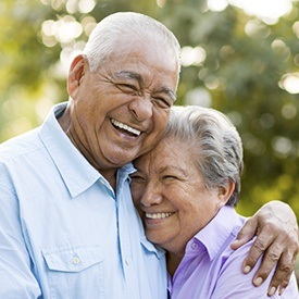 Older man and woman laughing togethr