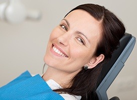 Smiling woman in dental exam chair