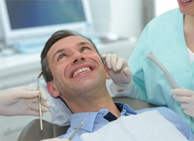 man smiling in dental chair