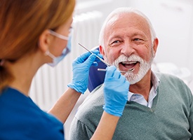 Dentist treats patient