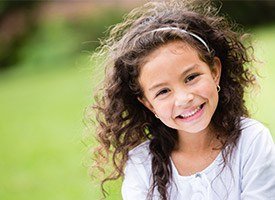 Smiling little girl outdoors