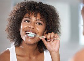 Woman brushing her teeth