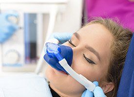 Woman with a nitrous oxide nasal mask