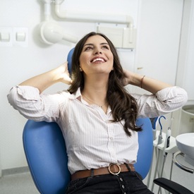 Smiling woman in dentist’s chair