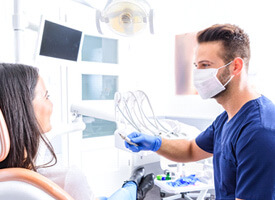 Female patient in dentist’s chair for a consultation