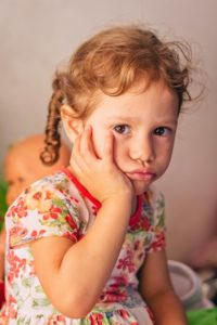 Sad child knocked-out tooth