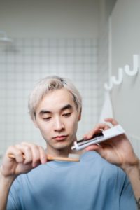 Man using bamboo toothbrush