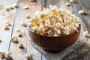 Bowl of popcorn on a wooden table
