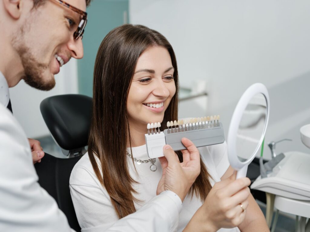 a woman picking out veneers at the dentist