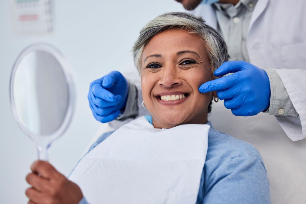 A smiling woman in a dentist’s chair